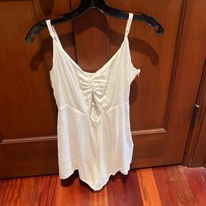 White romper. Size 8. Cutout on front. Zipper on side & clasp. Perfect condition